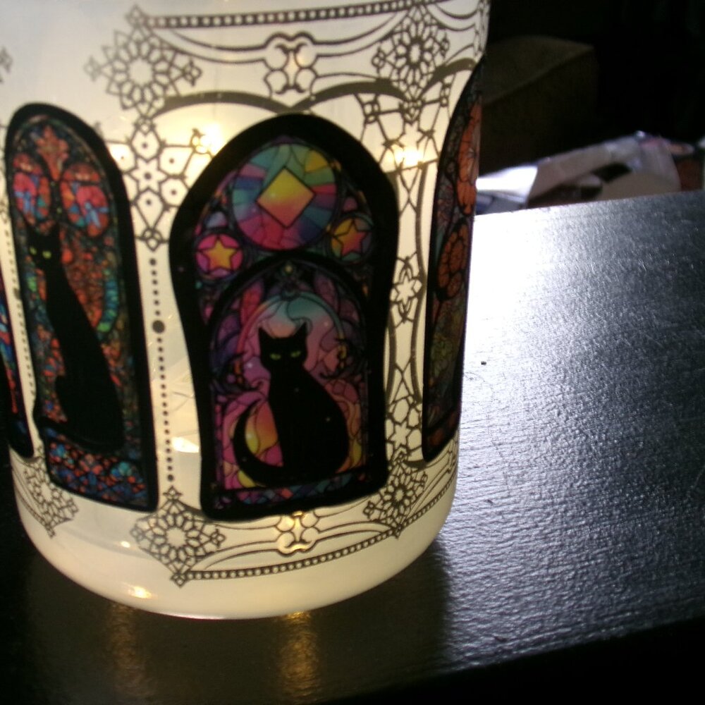 hand decorated glass candle holder. with led battery lights.